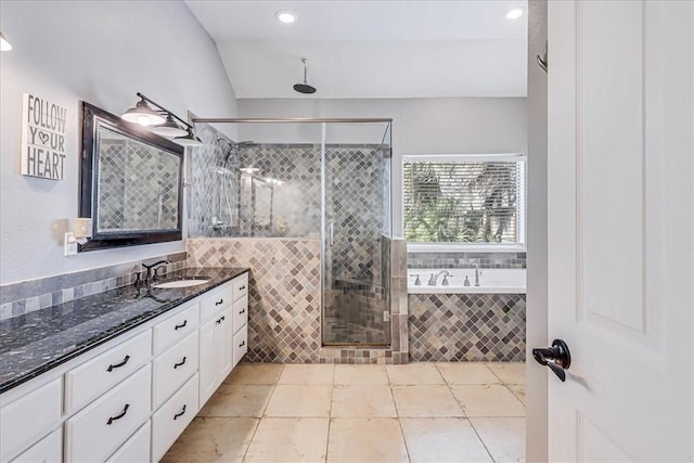 bathroom featuring separate shower and tub, tile patterned floors, and vanity