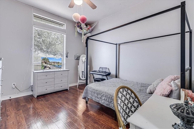 bedroom with ceiling fan and dark wood-type flooring