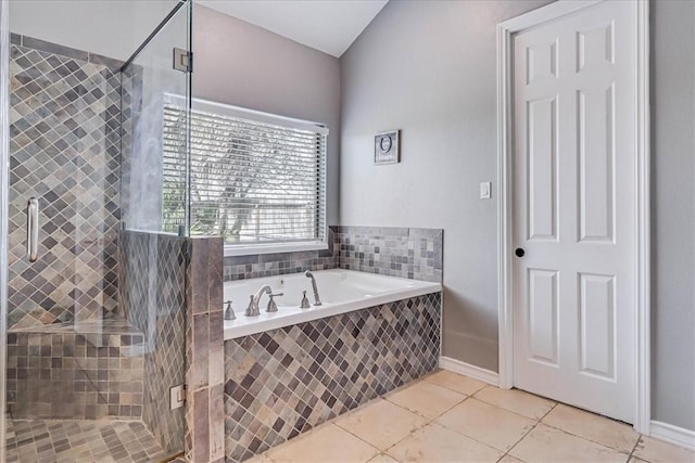 bathroom with tile patterned flooring and plus walk in shower