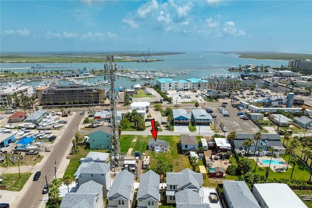 birds eye view of property with a water view