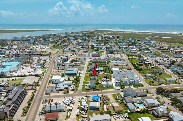 drone / aerial view with a water view and a view of the beach