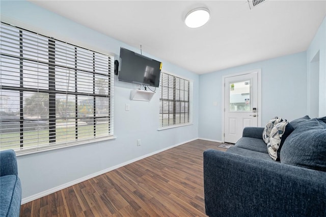 living room with dark wood-style floors and baseboards