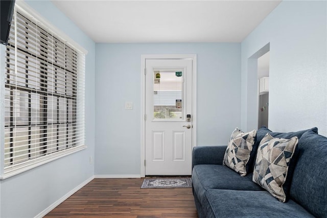 interior space featuring dark wood-style floors and baseboards