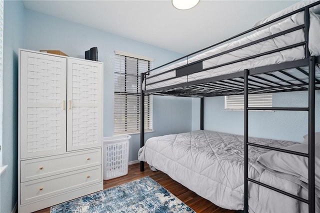 bedroom featuring dark wood-type flooring