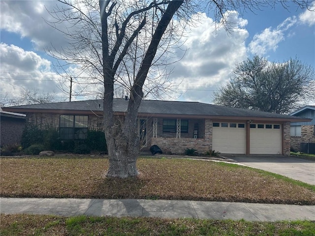 view of front of house featuring a garage and a front lawn