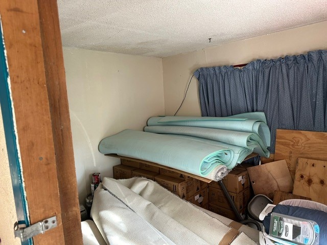 bedroom featuring a textured ceiling