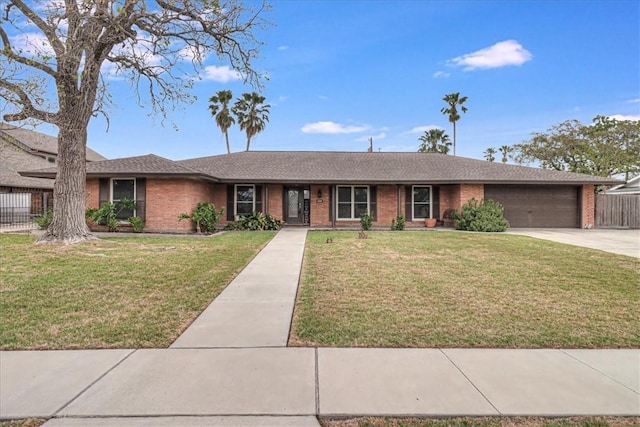 434 Cape Lookout Dr, Corpus Christi, TX 78412 - ranch-style house featuring brick siding, a garage, concrete driveway, and fence