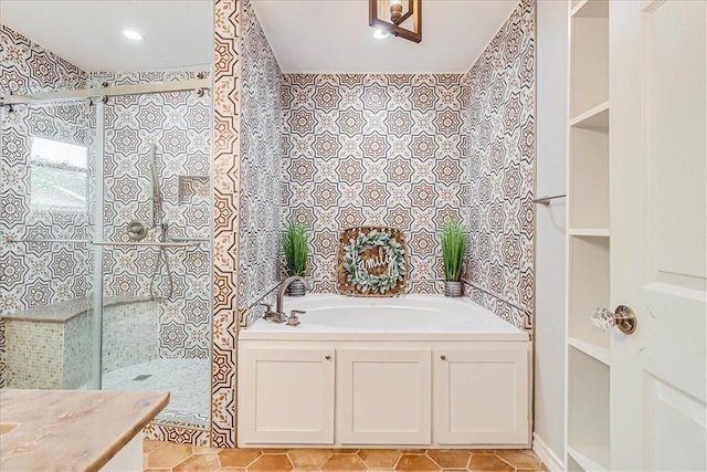 434 Cape Lookout Dr, Corpus Christi, TX 78412 - full bath featuring a shower stall, tile walls, vanity, and a bath