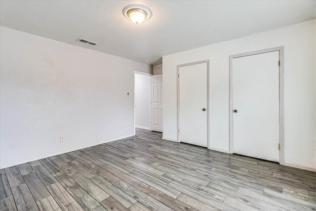 434 Cape Lookout Dr, Corpus Christi, TX 78412 - unfurnished bedroom featuring light wood finished floors and visible vents