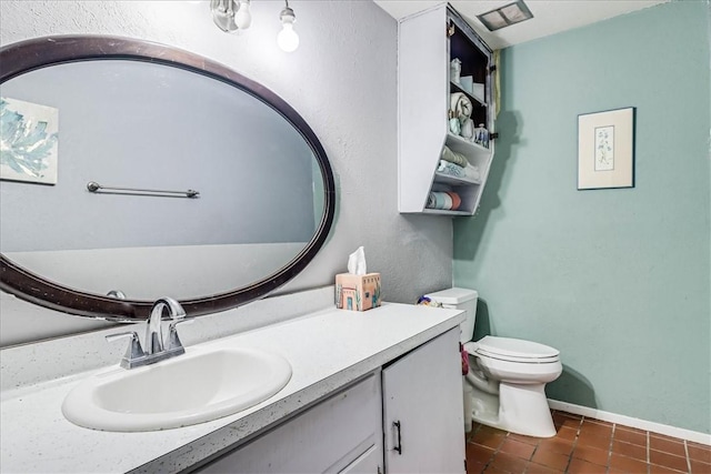 434 Cape Lookout Dr, Corpus Christi, TX 78412 - bathroom with baseboards, toilet, tile patterned flooring, and vanity