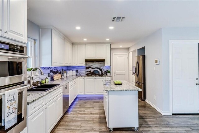 434 Cape Lookout Dr, Corpus Christi, TX 78412 - kitchen with a sink, visible vents, white cabinets, and appliances with stainless steel finishes
