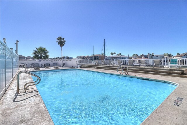 view of swimming pool with a patio area