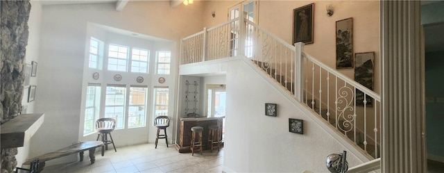 13757 Cayo Gorda Ct, Corpus Christi, TX 78418 - stairway with a high ceiling, plenty of natural light, and tile patterned flooring