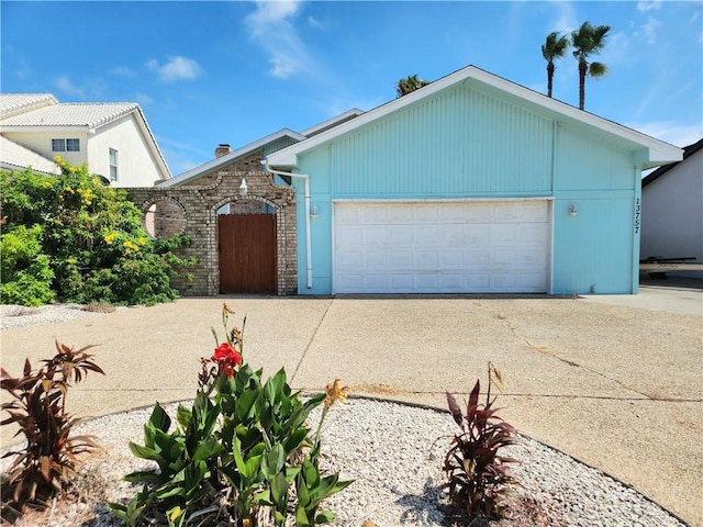 13757 Cayo Gorda Ct, Corpus Christi, TX 78418 - view of front of house with concrete driveway and an attached garage