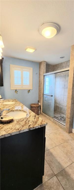 13757 Cayo Gorda Ct, Corpus Christi, TX 78418 - bathroom with a stall shower, vanity, and tile patterned floors