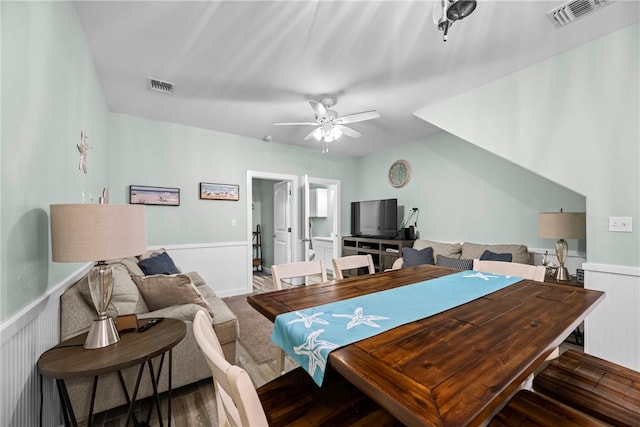 dining space featuring ceiling fan and dark hardwood / wood-style floors