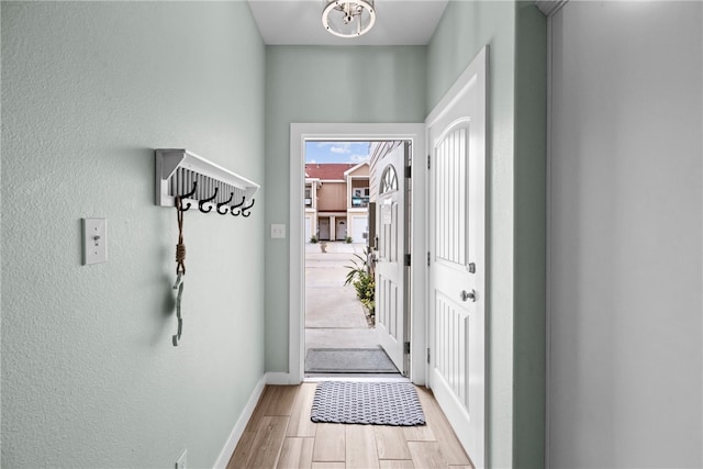 entryway with light hardwood / wood-style floors