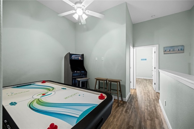 playroom featuring dark wood-type flooring and ceiling fan