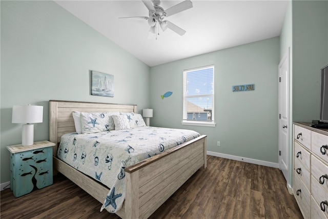 bedroom with dark wood-type flooring, ceiling fan, and vaulted ceiling