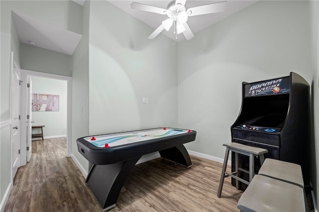 game room featuring hardwood / wood-style floors and ceiling fan