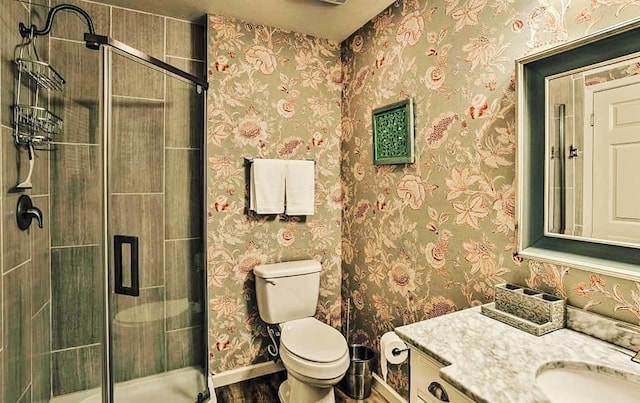 bathroom featuring a stall shower and wallpapered walls