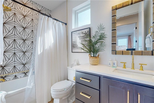 full bathroom featuring vanity, toilet, and shower / bathtub combination with curtain