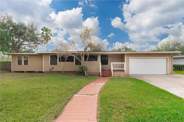 single story home with a garage and a front lawn