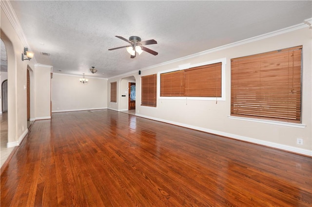 unfurnished living room featuring crown molding, dark hardwood / wood-style flooring, ceiling fan, and a textured ceiling