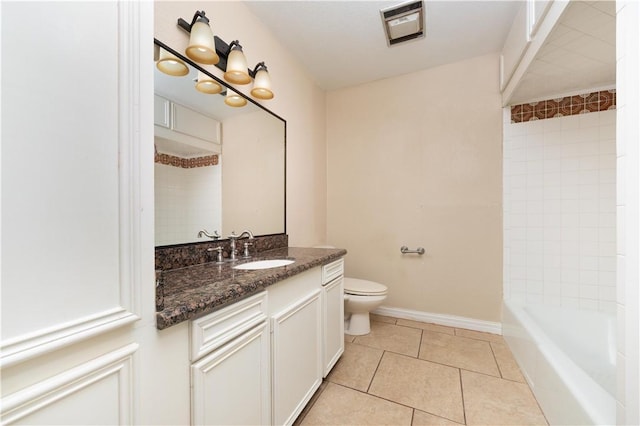 full bathroom with tiled shower / bath, tile patterned flooring, vanity, and toilet