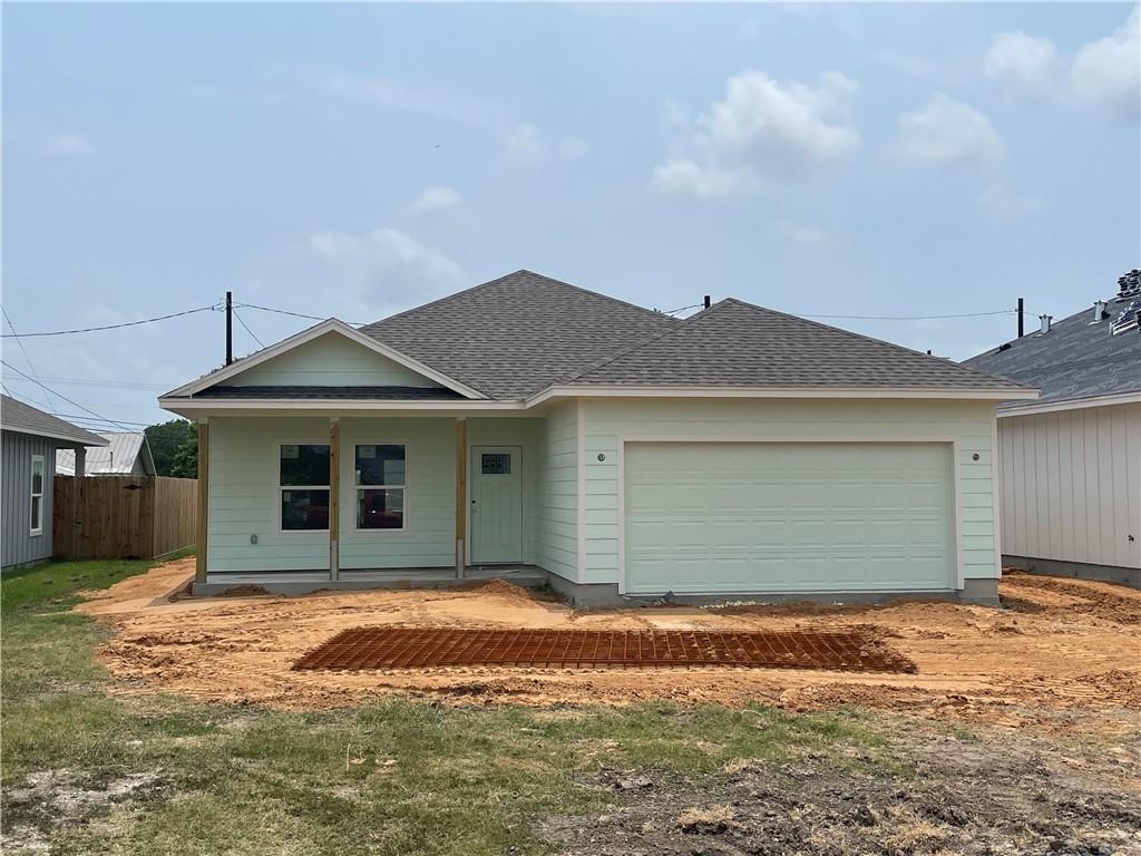 2990 Mayfield, Ingleside, TX 78362 - view of front facade featuring a porch, a garage, and a shingled roof