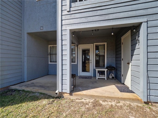 doorway to property featuring a patio area