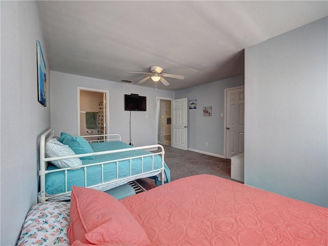 bedroom with ceiling fan, ensuite bathroom, and carpet flooring