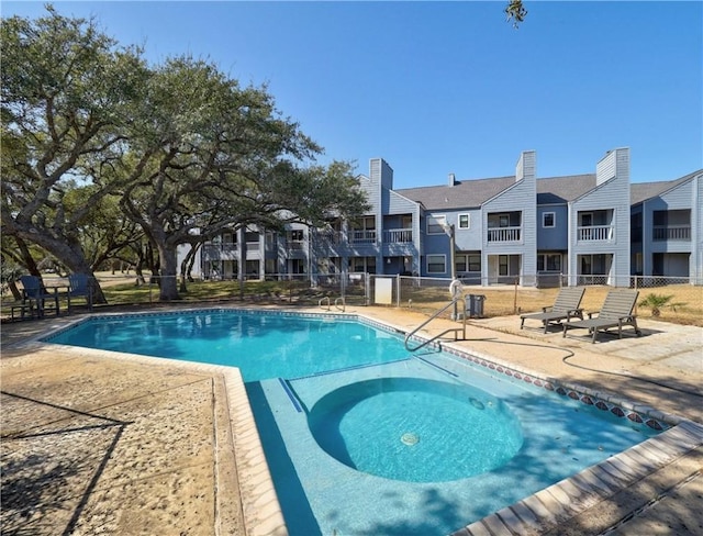 view of swimming pool with a patio