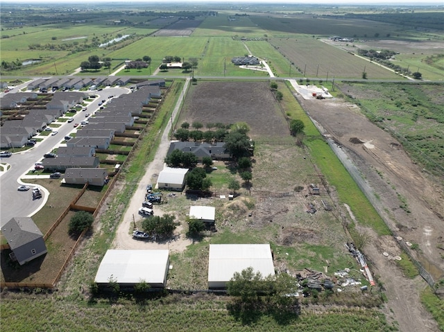 birds eye view of property with a rural view