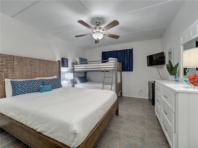 tiled bedroom with ceiling fan