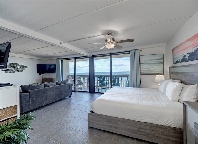 bedroom featuring expansive windows, access to outside, ceiling fan, and beamed ceiling