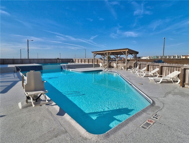 view of swimming pool featuring a gazebo and a patio area