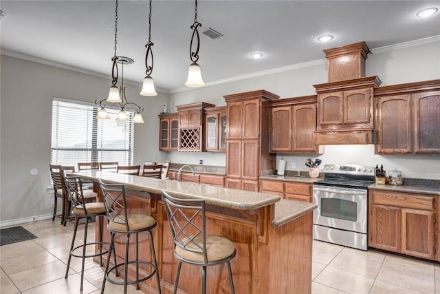 4465 S Oak Cir, Robstown, TX 78380 - kitchen with stainless steel range with electric stovetop, light tile patterned flooring, a breakfast bar area, a center island with sink, and glass insert cabinets