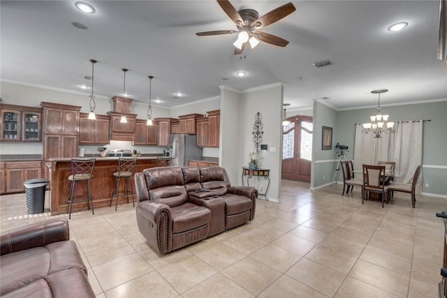 4465 S Oak Cir, Robstown, TX 78380 - living area with ceiling fan, crown molding, baseboards, a chandelier, and light tile patterned floors