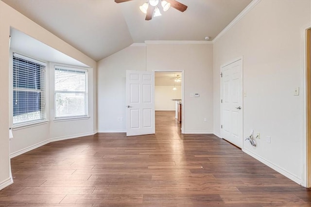 unfurnished bedroom with crown molding, ceiling fan, dark hardwood / wood-style flooring, and vaulted ceiling