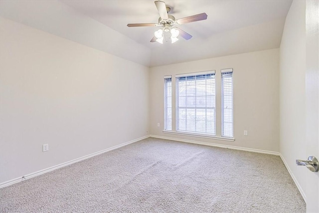 carpeted empty room with lofted ceiling and ceiling fan