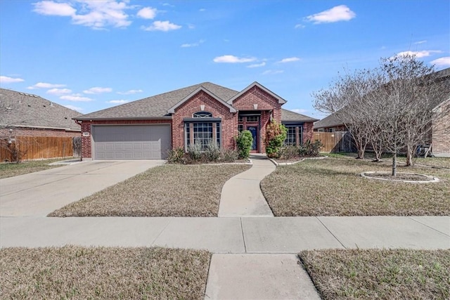 view of front of home with a garage and a front lawn