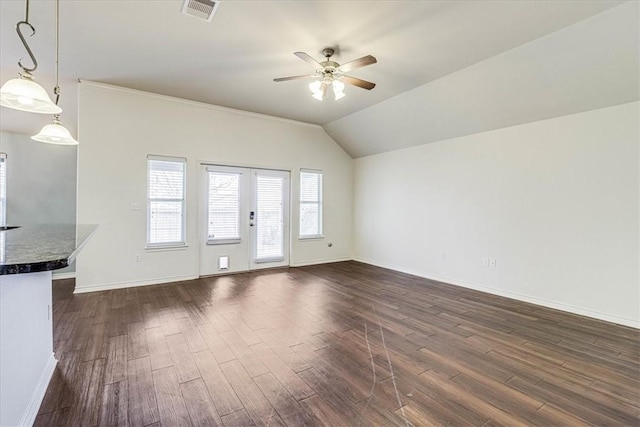 unfurnished living room featuring vaulted ceiling, dark hardwood / wood-style floors, and ceiling fan