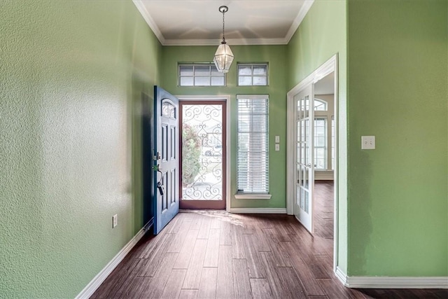 entryway featuring ornamental molding and wood-type flooring