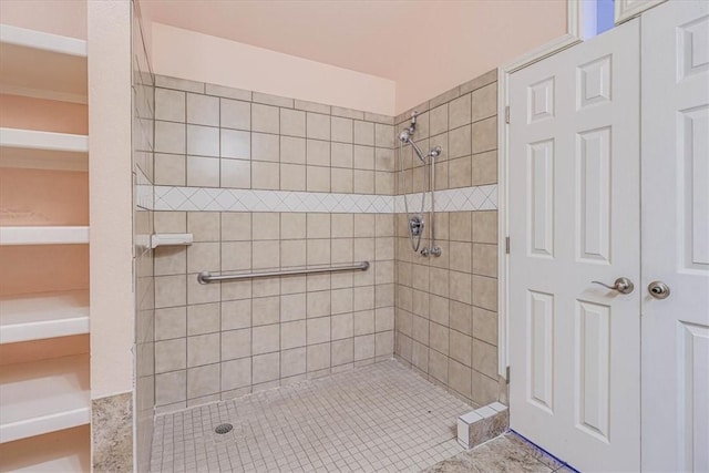 bathroom with tiled shower