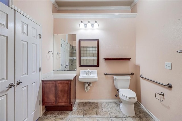 bathroom with ornamental molding, sink, and toilet