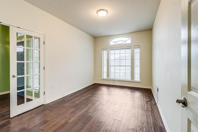 empty room featuring dark hardwood / wood-style flooring