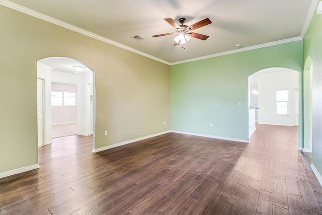 spare room featuring crown molding, ceiling fan, and dark hardwood / wood-style flooring