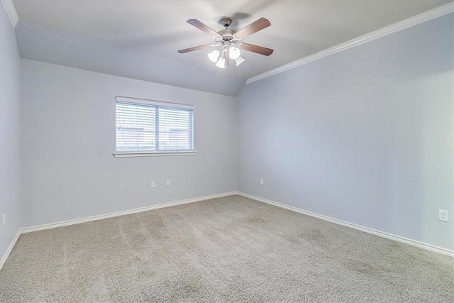 unfurnished room featuring crown molding, lofted ceiling, carpet flooring, and ceiling fan