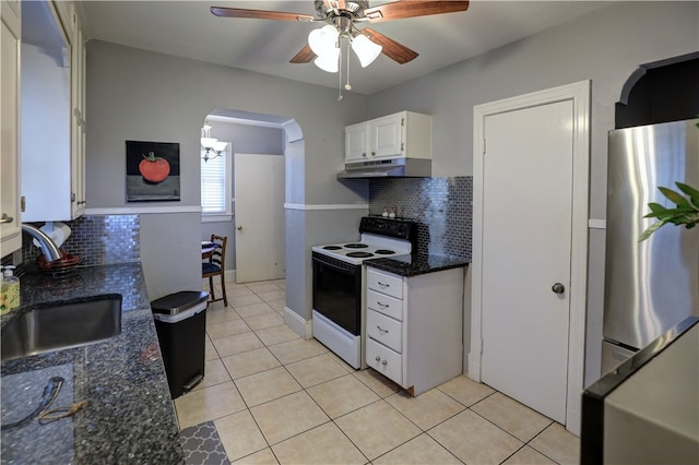 kitchen featuring white range with electric cooktop, white cabinets, sink, tasteful backsplash, and stainless steel refrigerator